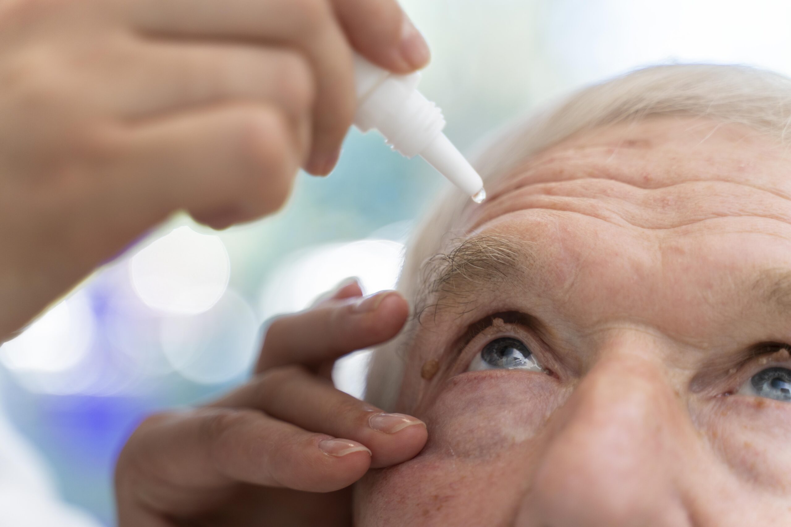 doctor-pouring-some-eye-drops-patient